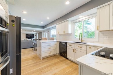 Welcome to this stunning, elegantly updated colonial nestled in on Hilltop Golf Course in Michigan - for sale on GolfHomes.com, golf home, golf lot