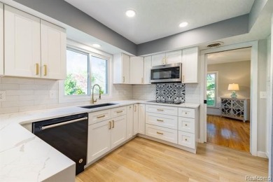 Welcome to this stunning, elegantly updated colonial nestled in on Hilltop Golf Course in Michigan - for sale on GolfHomes.com, golf home, golf lot