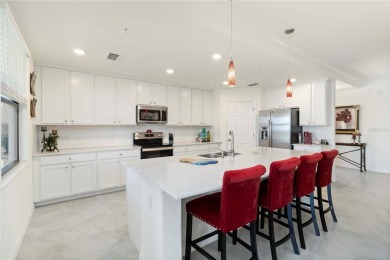 Stunning Ground-Floor Condo with Water Views in Sarasota on Sarasota National Golf Club in Florida - for sale on GolfHomes.com, golf home, golf lot