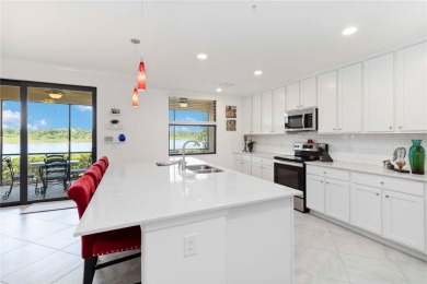Stunning Ground-Floor Condo with Water Views in Sarasota on Sarasota National Golf Club in Florida - for sale on GolfHomes.com, golf home, golf lot