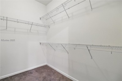 This beautifully maintained 3-bed, 2-bath home with a heated on Hilton Head Lakes Golf Club in South Carolina - for sale on GolfHomes.com, golf home, golf lot