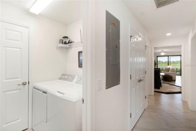 Stunning Ground-Floor Condo with Water Views in Sarasota on Sarasota National Golf Club in Florida - for sale on GolfHomes.com, golf home, golf lot