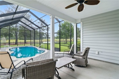 This beautifully maintained 3-bed, 2-bath home with a heated on Hilton Head Lakes Golf Club in South Carolina - for sale on GolfHomes.com, golf home, golf lot