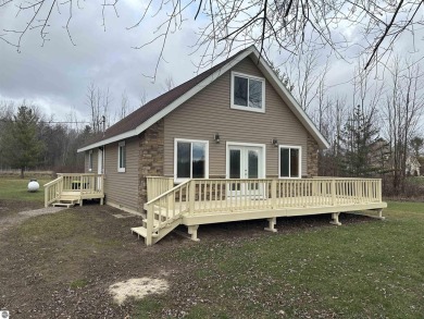 Very nicely updated story and a half home overlooking the Pine on Pine River Golf Club in Michigan - for sale on GolfHomes.com, golf home, golf lot