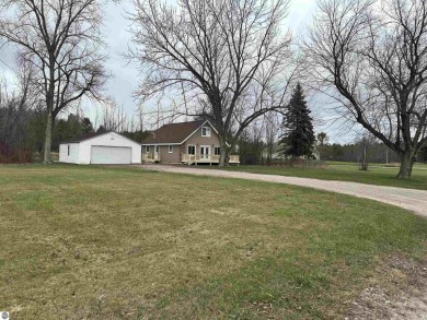 Very nicely updated story and a half home overlooking the Pine on Pine River Golf Club in Michigan - for sale on GolfHomes.com, golf home, golf lot