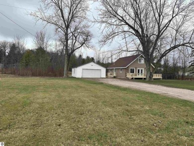 Very nicely updated story and a half home overlooking the Pine on Pine River Golf Club in Michigan - for sale on GolfHomes.com, golf home, golf lot