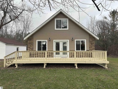 Very nicely updated story and a half home overlooking the Pine on Pine River Golf Club in Michigan - for sale on GolfHomes.com, golf home, golf lot