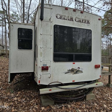 Beautiful camping lot located in the gated Lake Royale on River Golf and Country Club at Lake Royale in North Carolina - for sale on GolfHomes.com, golf home, golf lot