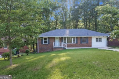 This charming 3-bedroom, 2-bath, 4-sided brick ranch in on Browns Mill Golf Course in Georgia - for sale on GolfHomes.com, golf home, golf lot