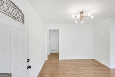 This charming 3-bedroom, 2-bath, 4-sided brick ranch in on Browns Mill Golf Course in Georgia - for sale on GolfHomes.com, golf home, golf lot