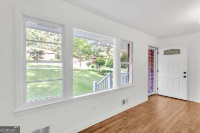 This charming 3-bedroom, 2-bath, 4-sided brick ranch in on Browns Mill Golf Course in Georgia - for sale on GolfHomes.com, golf home, golf lot