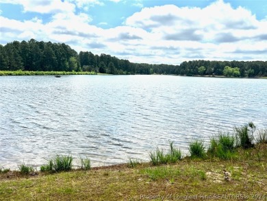 Breathtaking waterfront property within the exclusive Pinewild on Pinewild Country Club of Pinehurst in North Carolina - for sale on GolfHomes.com, golf home, golf lot