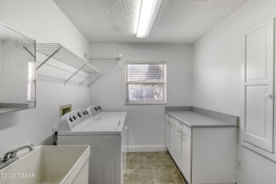 Come view this rarely available 4 bedroom, 2.5-bathroom ranch on Spruce Creek Golf Club in Florida - for sale on GolfHomes.com, golf home, golf lot