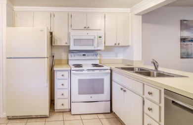 This is the best-priced unit in Villas de Golf and is available on Largo Golf Course in Florida - for sale on GolfHomes.com, golf home, golf lot