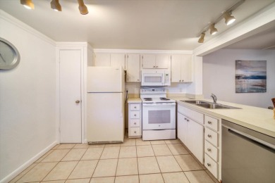 This is the best-priced unit in Villas de Golf and is available on Largo Golf Course in Florida - for sale on GolfHomes.com, golf home, golf lot