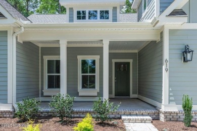 This brand new Riptide home with stunning setting and finishes on Sea Trail Golf Resort in North Carolina - for sale on GolfHomes.com, golf home, golf lot