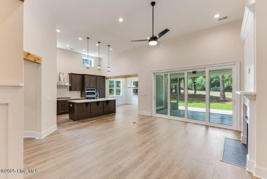 This brand new Riptide home with stunning setting and finishes on Sea Trail Golf Resort in North Carolina - for sale on GolfHomes.com, golf home, golf lot