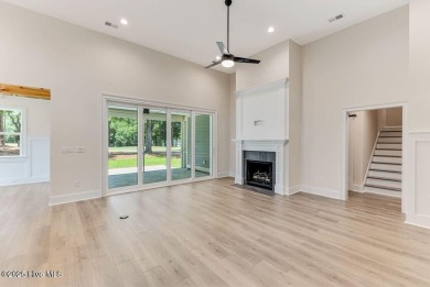 This brand new Riptide home with stunning setting and finishes on Sea Trail Golf Resort in North Carolina - for sale on GolfHomes.com, golf home, golf lot