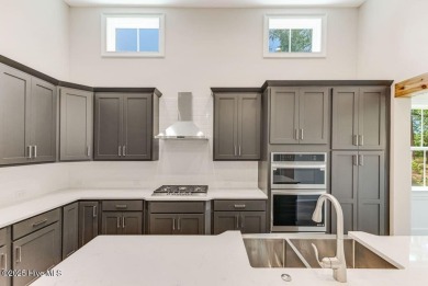 This brand new Riptide home with stunning setting and finishes on Sea Trail Golf Resort in North Carolina - for sale on GolfHomes.com, golf home, golf lot