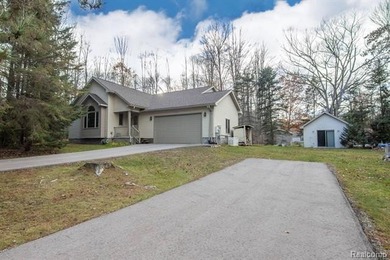Welcome to this ranch style home built in 2001 offering over 1 on Lost Lake Woods Club in Michigan - for sale on GolfHomes.com, golf home, golf lot