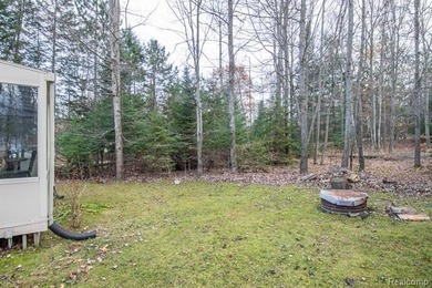 Welcome to this ranch style home built in 2001 offering over 1 on Lost Lake Woods Club in Michigan - for sale on GolfHomes.com, golf home, golf lot