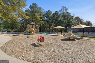 Completely updated and truly move-in ready, this elegant on Windermere Golf Club in Georgia - for sale on GolfHomes.com, golf home, golf lot