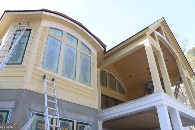 Introducing a New Construction luxurious custom home nestled in on Reynolds Lake Oconee - The Oconee in Georgia - for sale on GolfHomes.com, golf home, golf lot