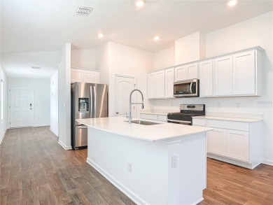 This nearly NEW 3-bedroom, 2-bath Berkeley floorplan offers 1 on Grand Reserve Golf Course in Florida - for sale on GolfHomes.com, golf home, golf lot