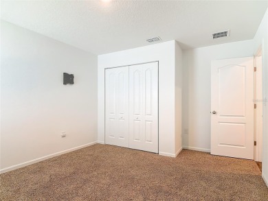 This nearly NEW 3-bedroom, 2-bath Berkeley floorplan offers 1 on Grand Reserve Golf Course in Florida - for sale on GolfHomes.com, golf home, golf lot