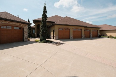 Exquisite design features, functional and luxurious living on The Ridge Golf Club in Iowa - for sale on GolfHomes.com, golf home, golf lot