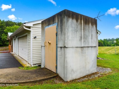 Endless possibilities await with this charming 2 bed/1 bath home on Dandridge Golf and Country Club in Tennessee - for sale on GolfHomes.com, golf home, golf lot