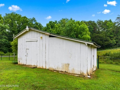 Endless possibilities await with this charming 2 bed/1 bath home on Dandridge Golf and Country Club in Tennessee - for sale on GolfHomes.com, golf home, golf lot