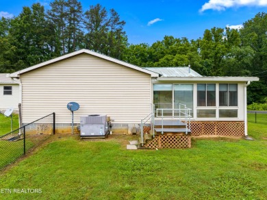 Endless possibilities await with this charming 2 bed/1 bath home on Dandridge Golf and Country Club in Tennessee - for sale on GolfHomes.com, golf home, golf lot