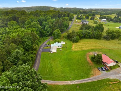 Endless possibilities await with this charming 2 bed/1 bath home on Dandridge Golf and Country Club in Tennessee - for sale on GolfHomes.com, golf home, golf lot