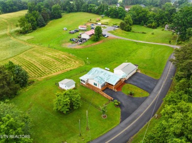 Endless possibilities await with this charming 2 bed/1 bath home on Dandridge Golf and Country Club in Tennessee - for sale on GolfHomes.com, golf home, golf lot