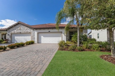 WATERFRONT VILLA IN HIGHLY SOUGHT AFTER ARBOR GRANDE IN LAKEWOOD on Esplanade Golf and Country at Lakewood Ranch in Florida - for sale on GolfHomes.com, golf home, golf lot