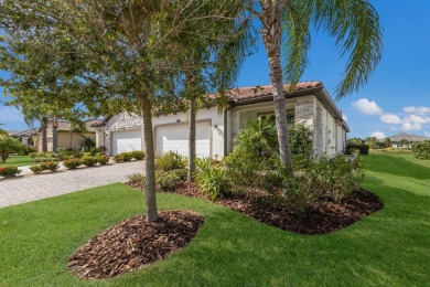 WATERFRONT VILLA IN HIGHLY SOUGHT AFTER ARBOR GRANDE IN LAKEWOOD on Esplanade Golf and Country at Lakewood Ranch in Florida - for sale on GolfHomes.com, golf home, golf lot