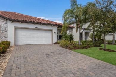 WATERFRONT VILLA IN HIGHLY SOUGHT AFTER ARBOR GRANDE IN LAKEWOOD on Esplanade Golf and Country at Lakewood Ranch in Florida - for sale on GolfHomes.com, golf home, golf lot