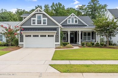 Experience vibrant community living at 6441 Saxon Meadow Drive on Cape Fear National At Brunswick Forest in North Carolina - for sale on GolfHomes.com, golf home, golf lot