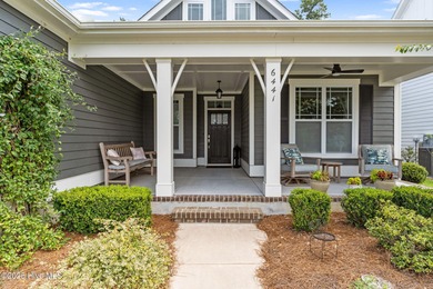 Experience vibrant community living at 6441 Saxon Meadow Drive on Cape Fear National At Brunswick Forest in North Carolina - for sale on GolfHomes.com, golf home, golf lot