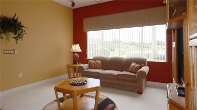 Sought after lake views  in Tamarron. Great curb appeal on Eagle Ridge At Spruce Creek Country Club in Florida - for sale on GolfHomes.com, golf home, golf lot