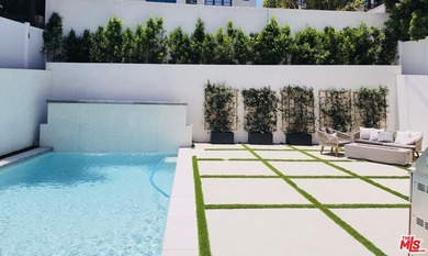 Prepare to be enchanted by one of the most beautiful homes ever on Rancho Park Golf Course in California - for sale on GolfHomes.com, golf home, golf lot