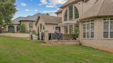 Step into timeless elegance with this expansive three-level home on RidgePointe Country Club in Arkansas - for sale on GolfHomes.com, golf home, golf lot