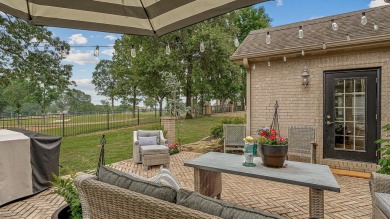 Step into timeless elegance with this expansive three-level home on RidgePointe Country Club in Arkansas - for sale on GolfHomes.com, golf home, golf lot