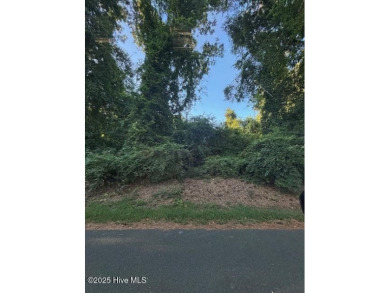 Nestled on a gently sloping interior lot, this prime parcel on Seven Lakes Country Club in North Carolina - for sale on GolfHomes.com, golf home, golf lot