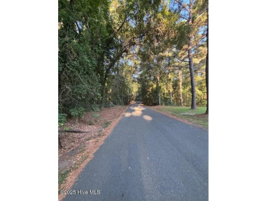 Nestled on a gently sloping interior lot, this prime parcel on Seven Lakes Country Club in North Carolina - for sale on GolfHomes.com, golf home, golf lot