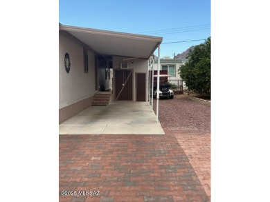 Newer Cavco 2006 home with many updates including exterior on Tucson Estates Golf Course in Arizona - for sale on GolfHomes.com, golf home, golf lot