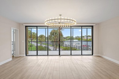 Beautiful waterfront condo in the gated community of Jonathan's on Jonathans Landing Golf Club in Florida - for sale on GolfHomes.com, golf home, golf lot