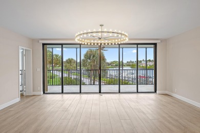 Beautifully updated waterfront condo in the gated community of on Jonathans Landing Golf Club in Florida - for sale on GolfHomes.com, golf home, golf lot