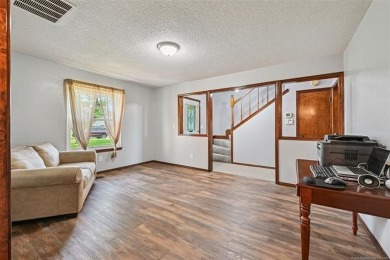 This spacious home sits on a fully fenced 0.61-acre lot and on Forest Ridge Golf Club in Oklahoma - for sale on GolfHomes.com, golf home, golf lot
